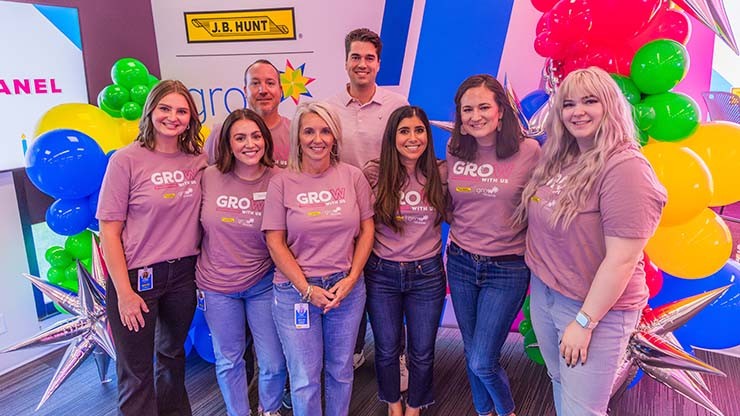 Members of GROW gathered together for a group photo at an event.