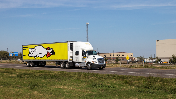 DCS truck with Chicken Express Branding going down the highway