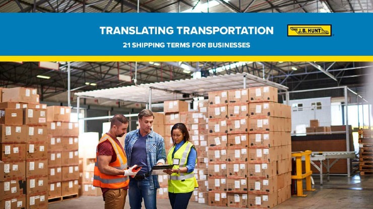 21 Shipping Terms Every Business Should Know Three individuals look at a digital tablet in a warehouse