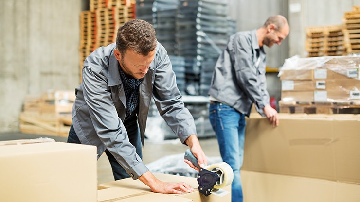 Photo Image of Worker Taping up a Box
