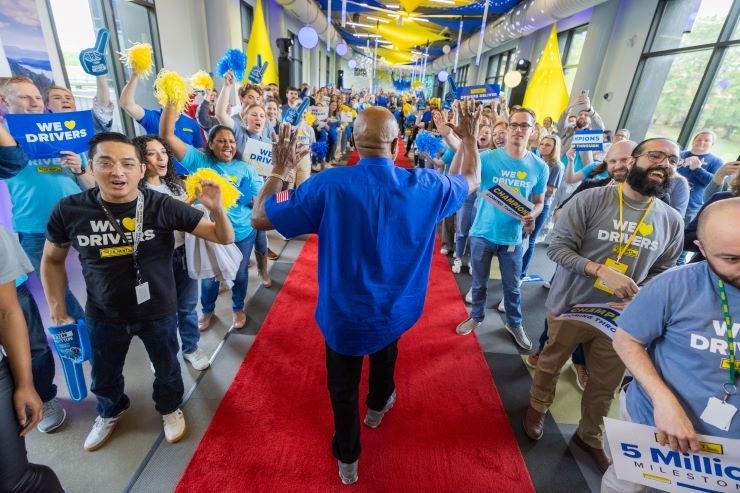 driver walks down the million mile walk of fame to cheering employees