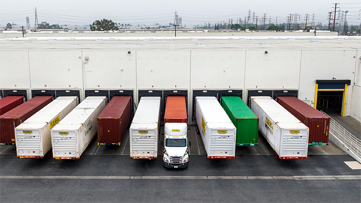 row of trailers at loading dock a row trailers parked in a loading dock