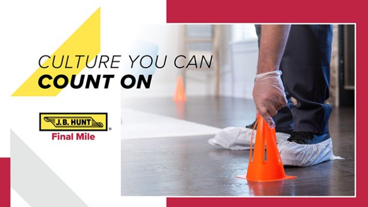 A Final Mile employee places an orange cone on the floor
