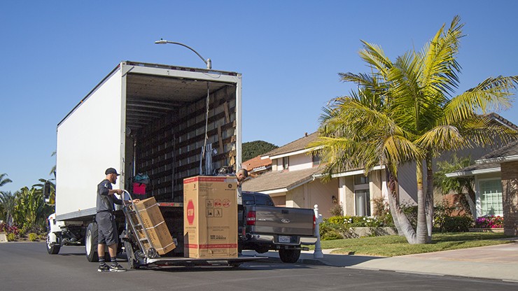 a final mile driver unloads a straight truck
