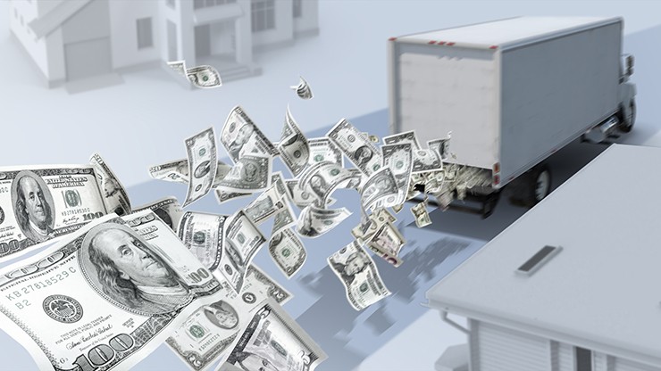 hidden cost blog image truck with dollar bills flying out of the back