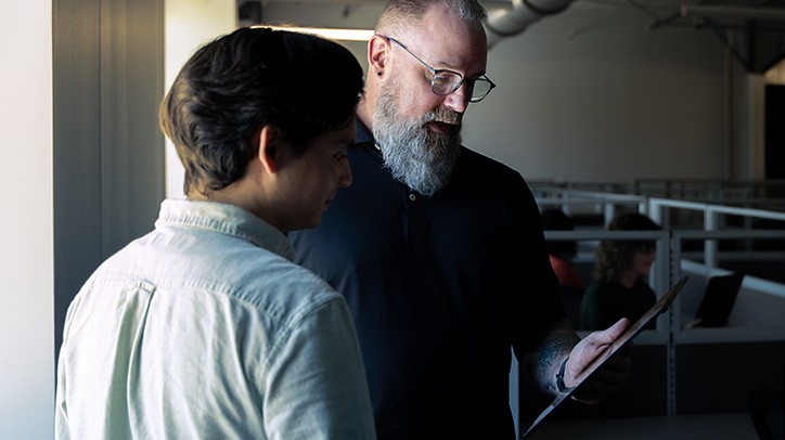 Two Men Viewing a Screen Two Men Viewing a Screen
