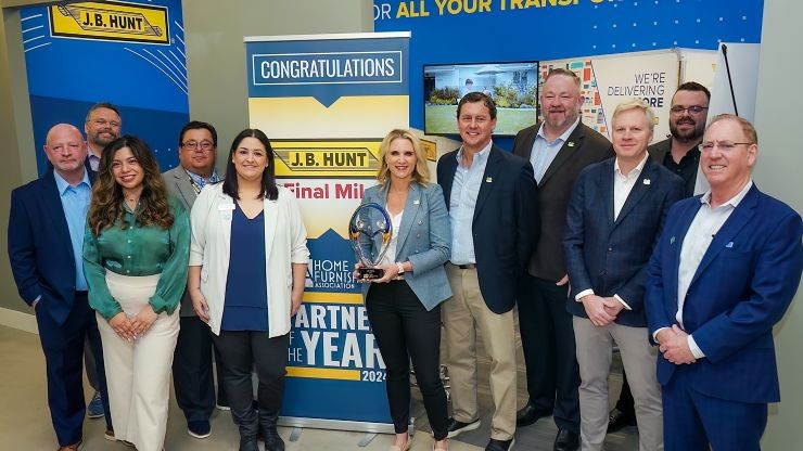 J.B. Hunt employees showing off their Home Furnishings Association award J.B. Hunt employees showing off their Home Furnishings Association award