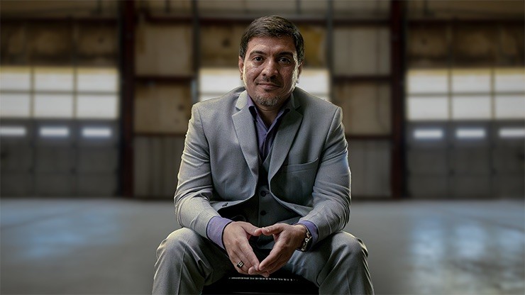 Old City Transport COO Husan Shares Success with J.B. Hunt Partnership Husan, COO of Old City Transport, sitting confidently in a warehouse, reflecting on company growth with J.B. Hunt partnership