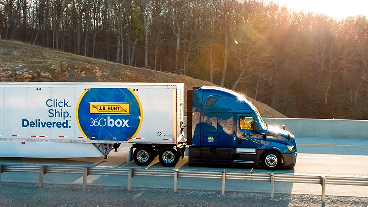 A truck hauling a J.B. Hunt 360box trailer on the road