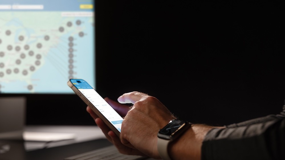 carrier using phone at desk
