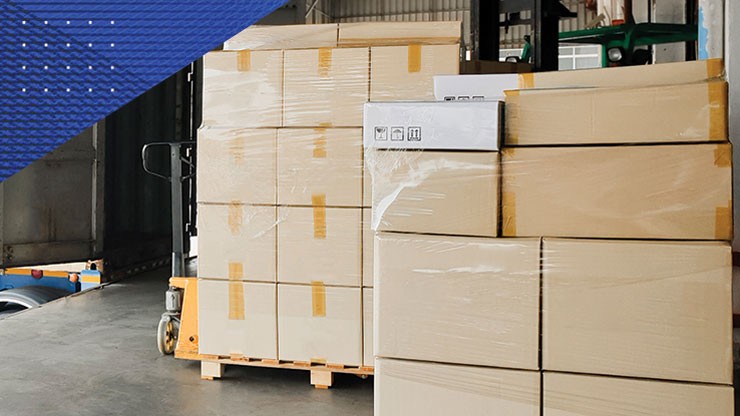 pallets of boxes sitting in a warehouse.