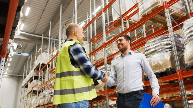 Shipper and customer shaking hands