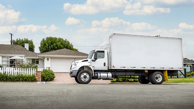 straight truck in front of house