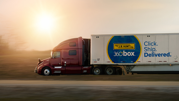 unmarked truck with 360box trailer travels down the highway