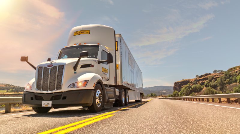 wide shot of truck on a highway