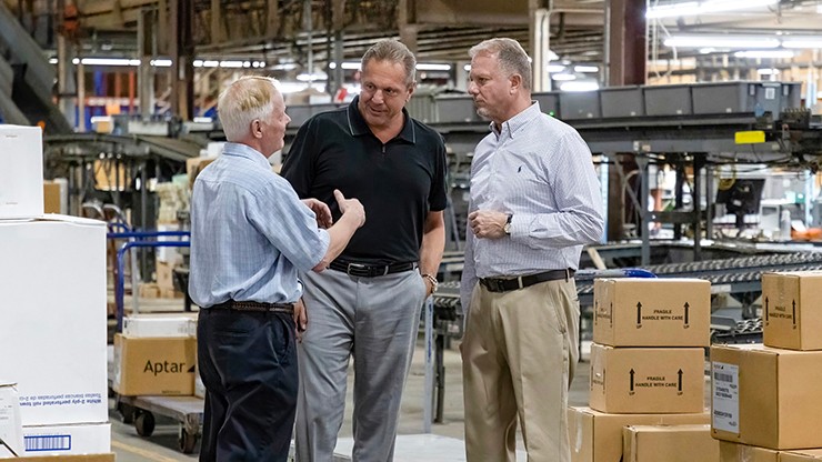j.b. hunt employees talking to customer in warehouse
