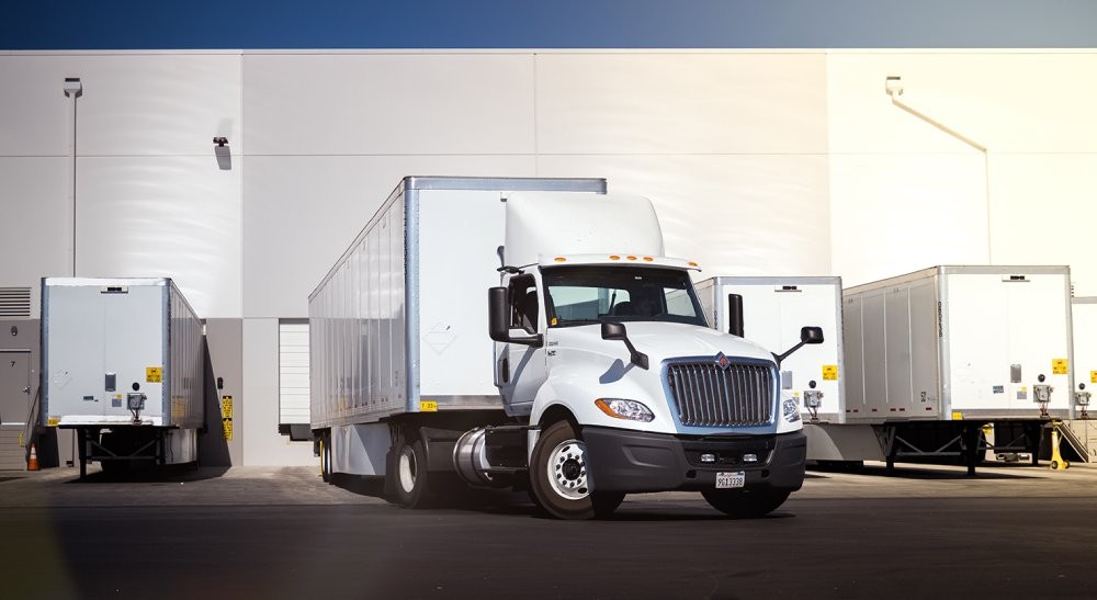a truck at a dock at a warehouse facility