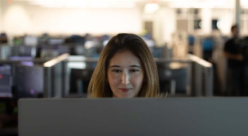 woman at computer looking at screen