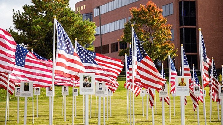 photo of American flags honoring veterans placed outside the J.B. Hunt corporate headquarters