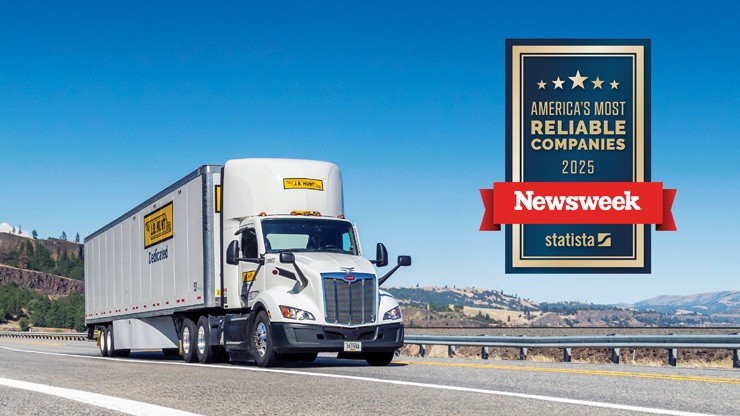 jb-hunt-americas-most-reliable-companies-newsweek-2025 J.B. Hunt semi-truck driving on a scenic highway with the Newsweek award badge for America's Most Reliable Companies 2025 displayed prominently.