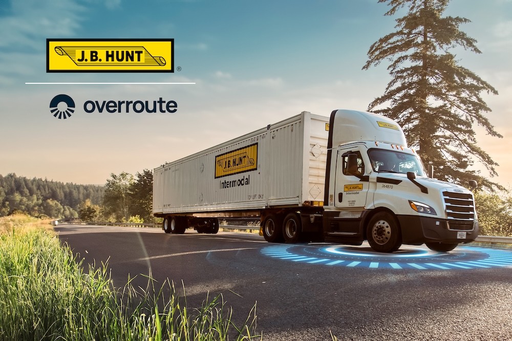truck on the road with overroute tracking emblem below