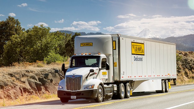 dedicated contract services truck on the highway