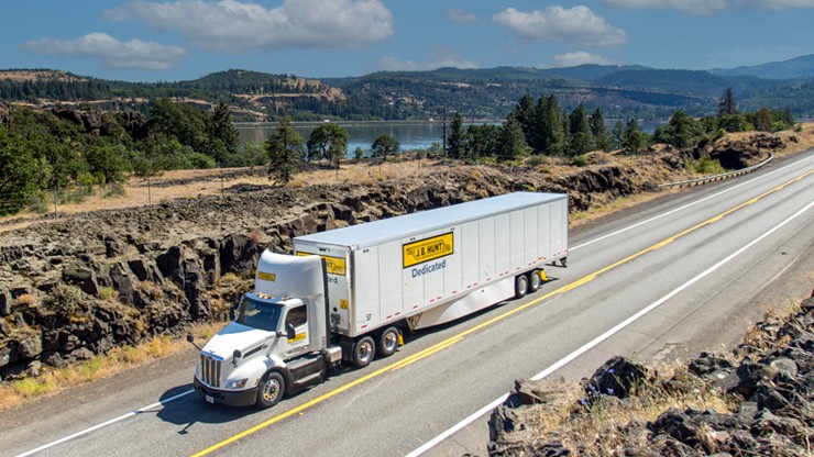 dedicated contract services truck on rural highway