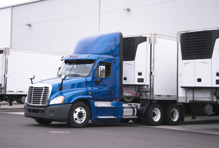 Tractor trailer parked at loading dock