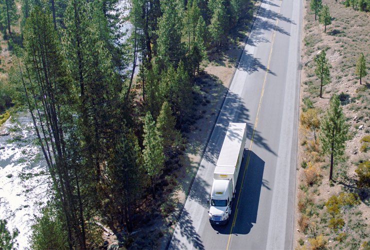 J.B. Hunt tractor trailer on two lane highway