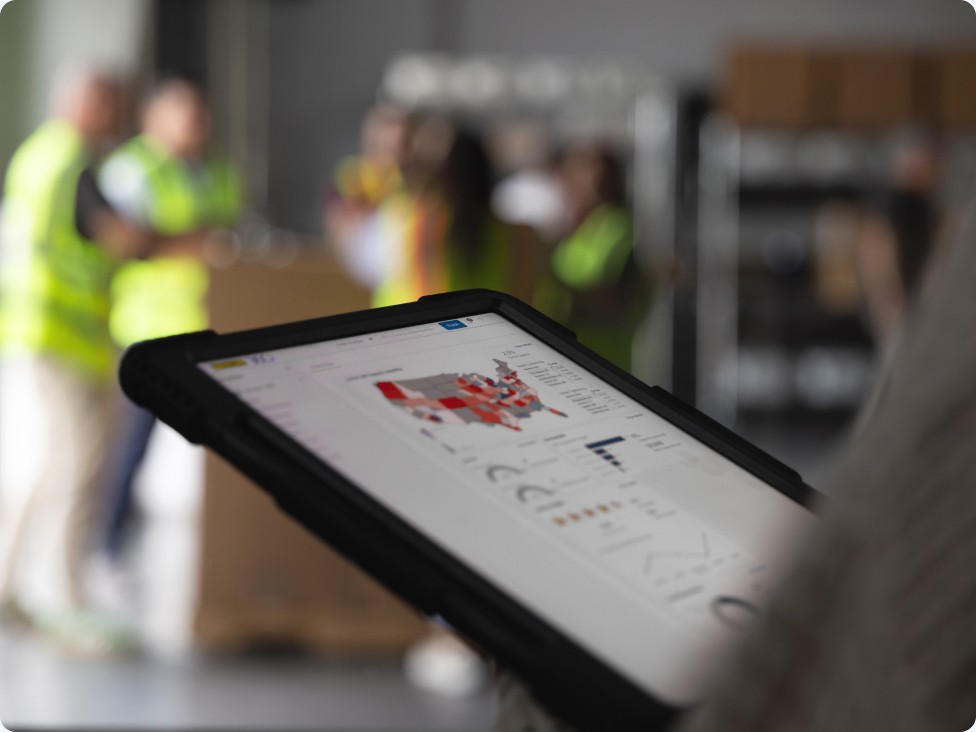 employee using tablet in a warehouse