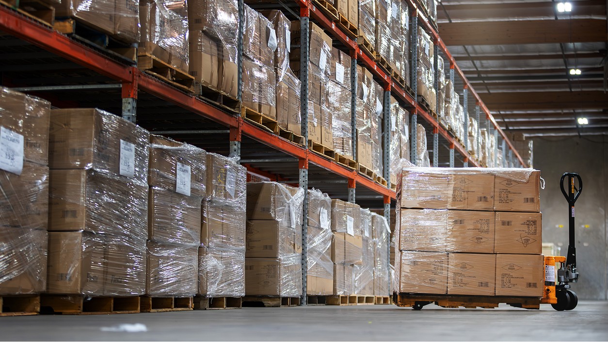 warehouse full of less than truckload loads with one pallet on a palletjack