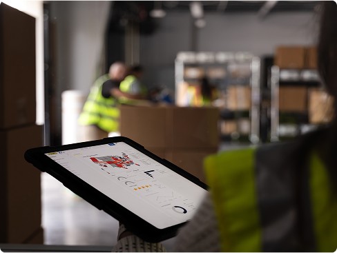 Employee in warehouse with ipad